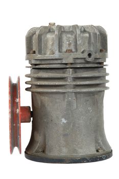 Old air compressor with pulley, isolated on white background