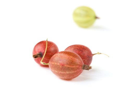 Red and green gooseberry isolated on a white background