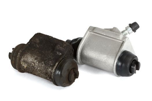 Old and new hydraulic cylinders brake, isolated on a white background