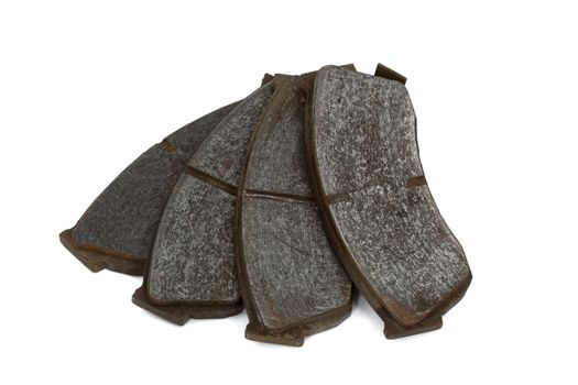 Old brake pads disk brake, isolated on a white background