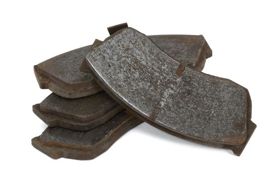 Old brake pads disk brake, isolated on a white background