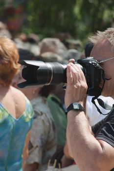 Photographer holding a the camera