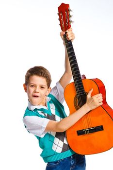 Cute boy with classical guitar. Isolated on white background