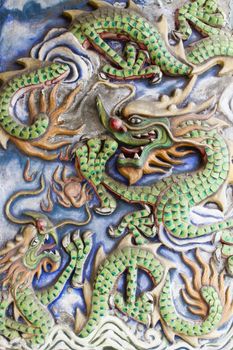 Dragons Motif Carvings Outside Old Chinese Temple Wall