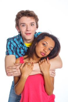 Smiling young man with pretty mullato girlfriend. Isolated on white background.