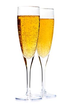 Two full champagne flutes isolated on white background