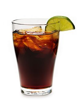 Glass of cola with ice and lime isolated on white background