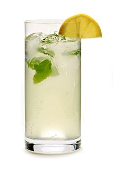 Glass of sparkling lemonade with mint and ice