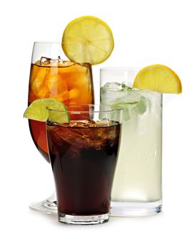 Group of three soft drinks in various glasses with garnish