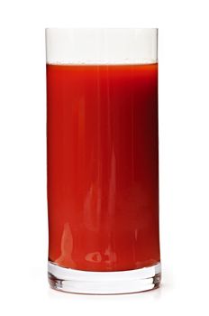 Tomato juice in clear glass isolated on white background