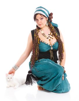 Oriental dancer in blue costume over white background