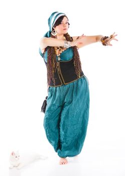 Oriental dancer in blue costume over white background
