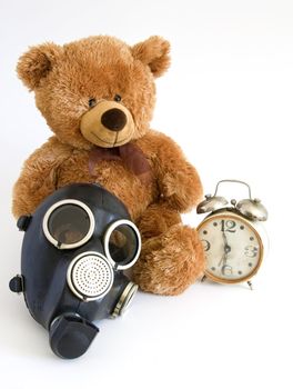 The Nursery toy, gas mask, old watch on white background.