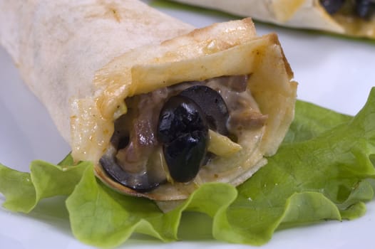 Pancakes with mushrooms, olives and green salad.