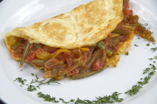 Pancakes with vegetables on a white plate.