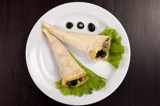 Pancakes with mushrooms, olives and green salad.