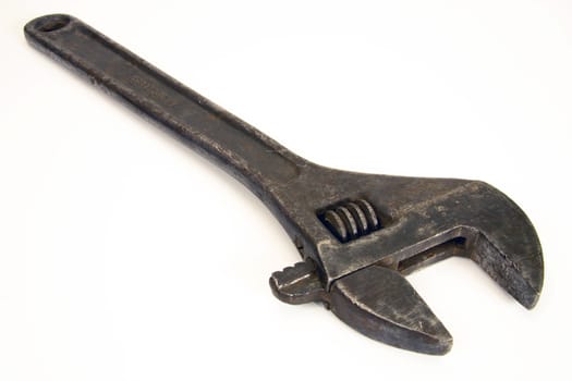 Old spanner on a white background.