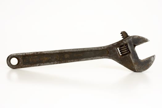 Old spanner on a white background.