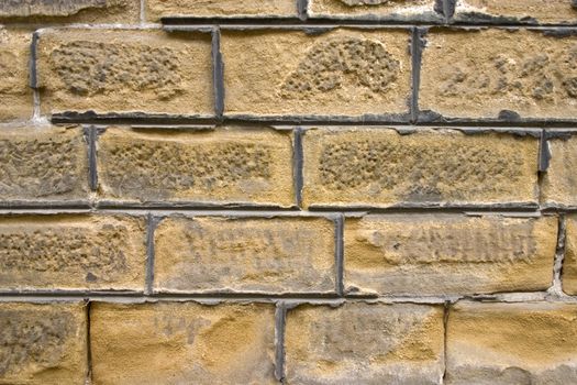 Old wall of a yellow brick.
