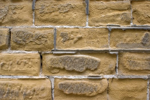 Old wall of a yellow brick.