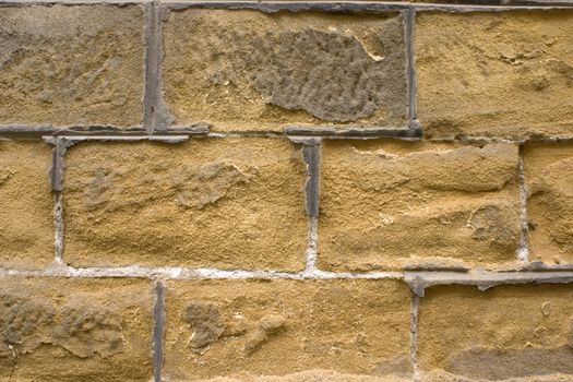 Old wall of a yellow brick.