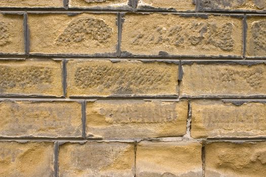 Old wall of a yellow brick.
