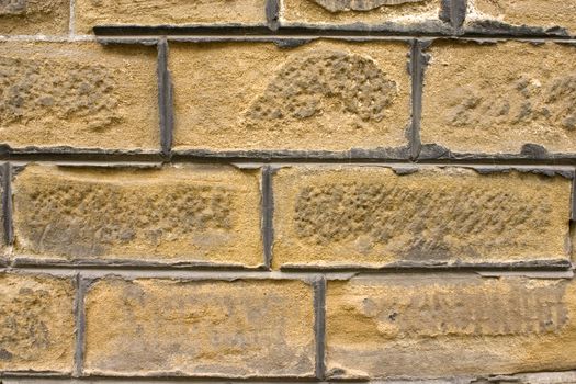 Old wall of a yellow brick.