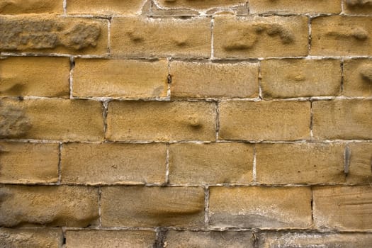 Old wall of a yellow brick.