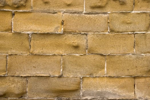 Old wall of a yellow brick.