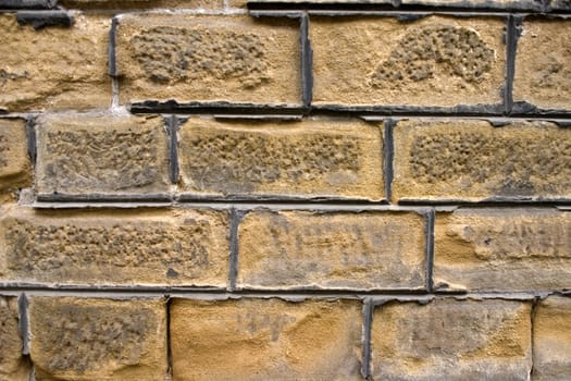 Old wall of a yellow brick.