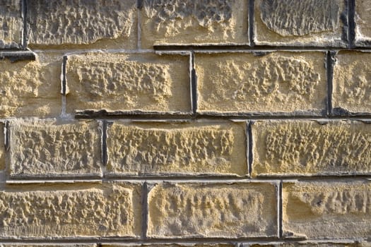Old wall from a yellow brick.