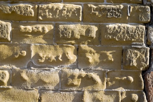 Old wall from a yellow brick.
