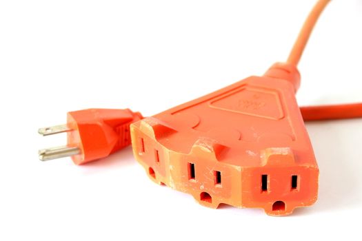 Isolated orange extension cord with 3 outlets.