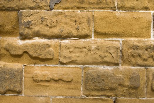 Old wall of a yellow brick.