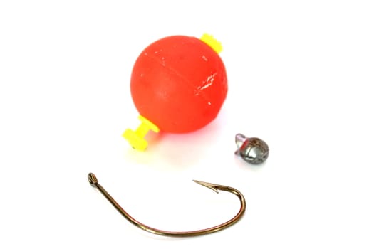 Isolated fishing gear including a hook, bobber, and sinker.