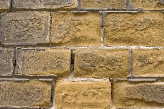 Old wall of a yellow brick.