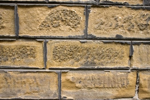 Old wall of a yellow brick.