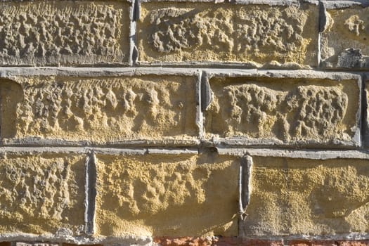 Old wall from a yellow brick.