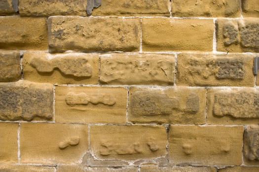 Old wall of a yellow brick.