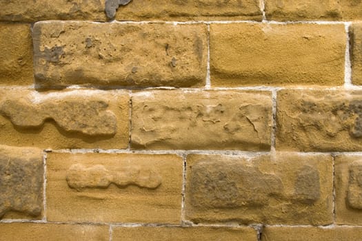 Old wall of a yellow brick.