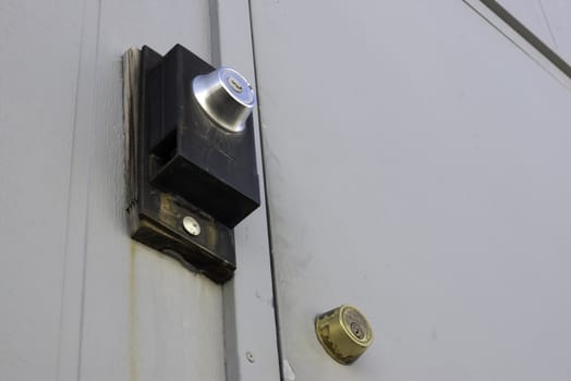 double dead bolt locks on a door of a building for security