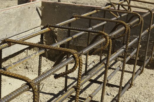 rebar and forms tied for concrete in construction in daylight