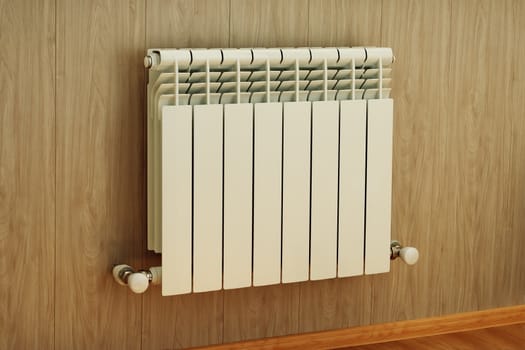 Wall mounted radiator for central heating in the house on a wooden wall