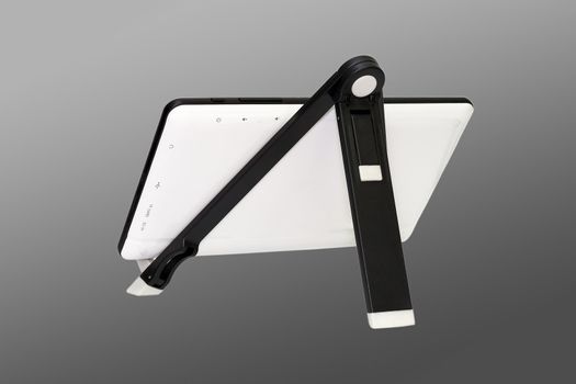 A small stand to hold and support touchpads or ebook readers