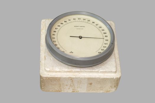Aneroid barometer, made ​​in the USSR, isolated on a white background.