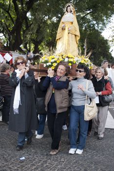 Argentina - Buenos Aires - May 15, 2012:women taking the Virgin during prosecion in commemoration of the celebration of San Isidro Labrador in the cathedral that bears his name located in the province of Buenos Aires