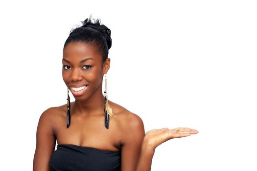 A lovely young black hostess holding her left hand out, palm up.  Isolated on a white background with generous copyspace.