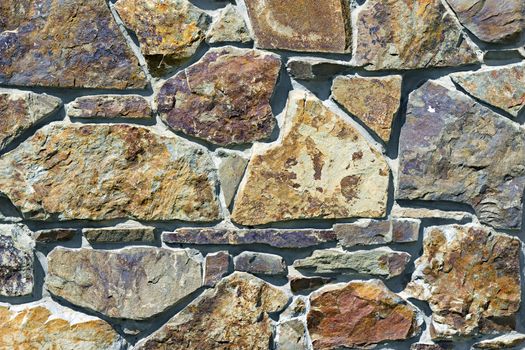 wall of rough stones in the background