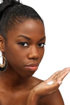 A studio close-up of a lovely young black woman with lotion in her hand.