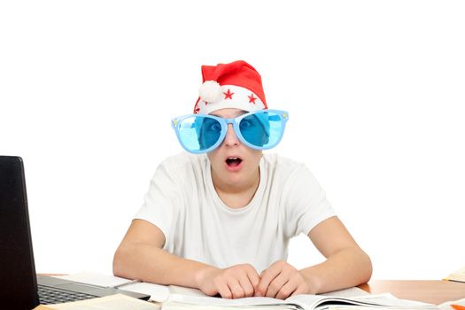 amazed student in santa's hat and big blue glasses. isolated on the white background